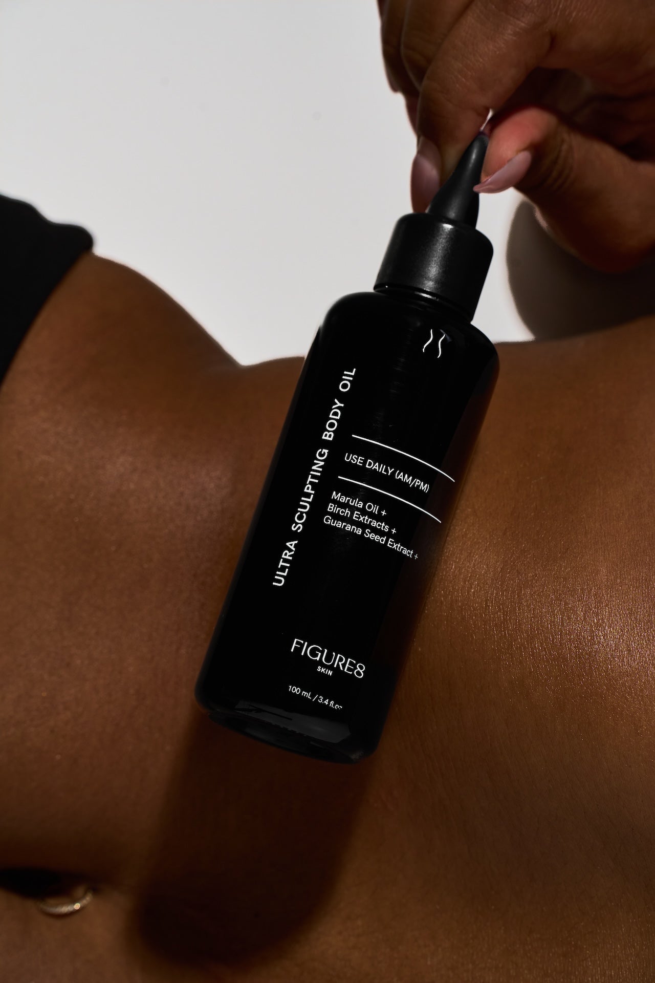 Black bottle of FIGUR8 ultra sculpting body oil being applied to skin.

anti aging skincare, best anti aging skincare, skin tightening products, firming skincare products, collagen skincare products, peptide serum for skin, skin tightening cream, best serum for aging skin, hydration skincare, skin barrier repair skincare, medical grade anti aging skincare, professional skincare line, skincare for fine lines, skincare for wrinkles, skincare for elasticity, skincare for sagging skin, advanced anti aging skinc